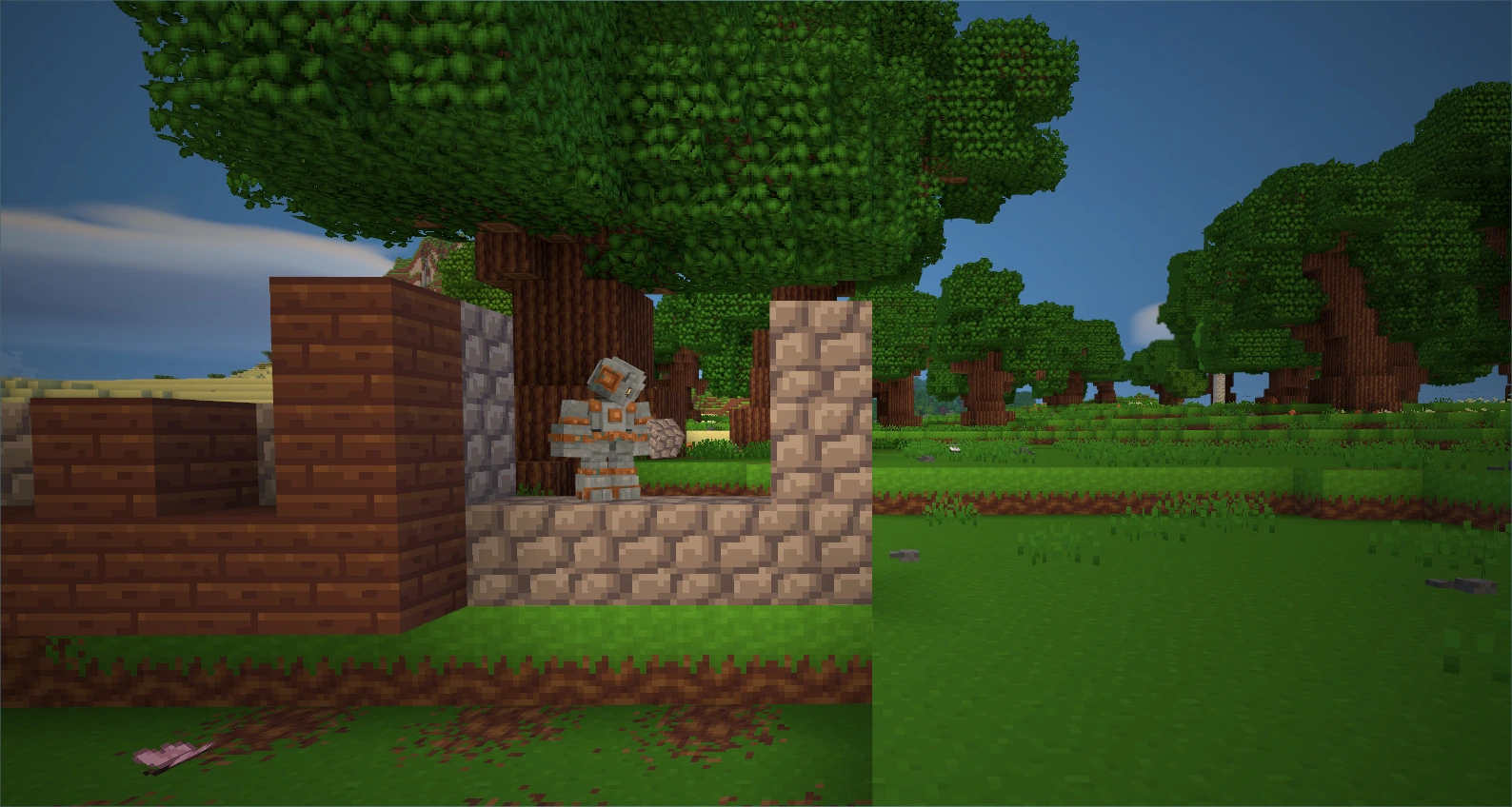 A Mason Golem holding a stone block beside the unfinished timber-and-stone walls of a building beneath the trees